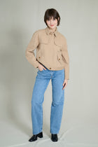 Trench courte beige avec col à cordons