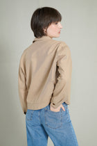 Trench courte beige avec col à cordons