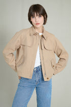 Trench courte beige avec col à cordons