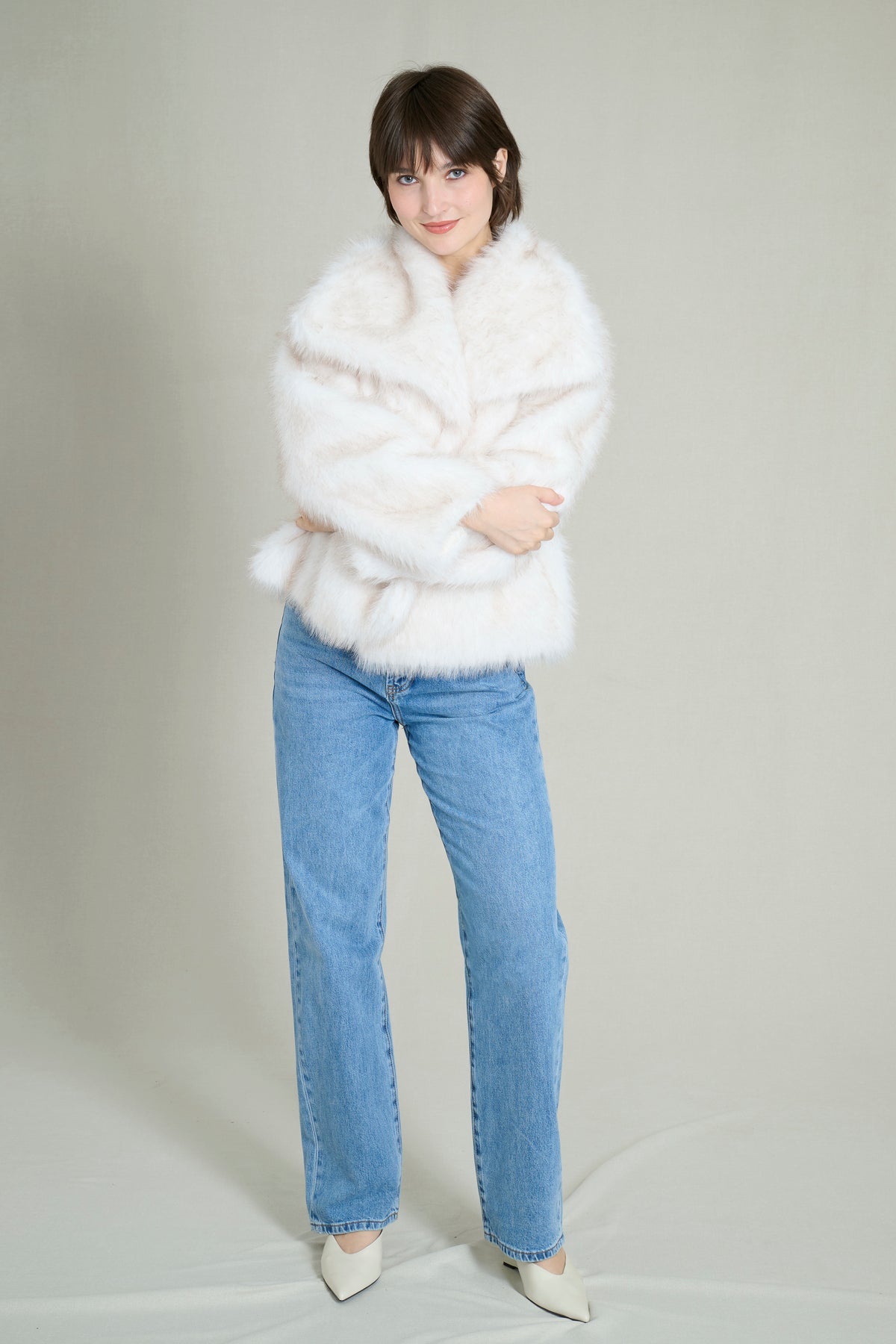 Manteau fausse fourrure crème