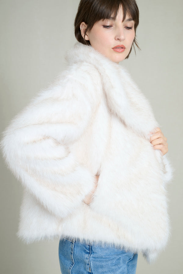 Manteau fausse fourrure crème